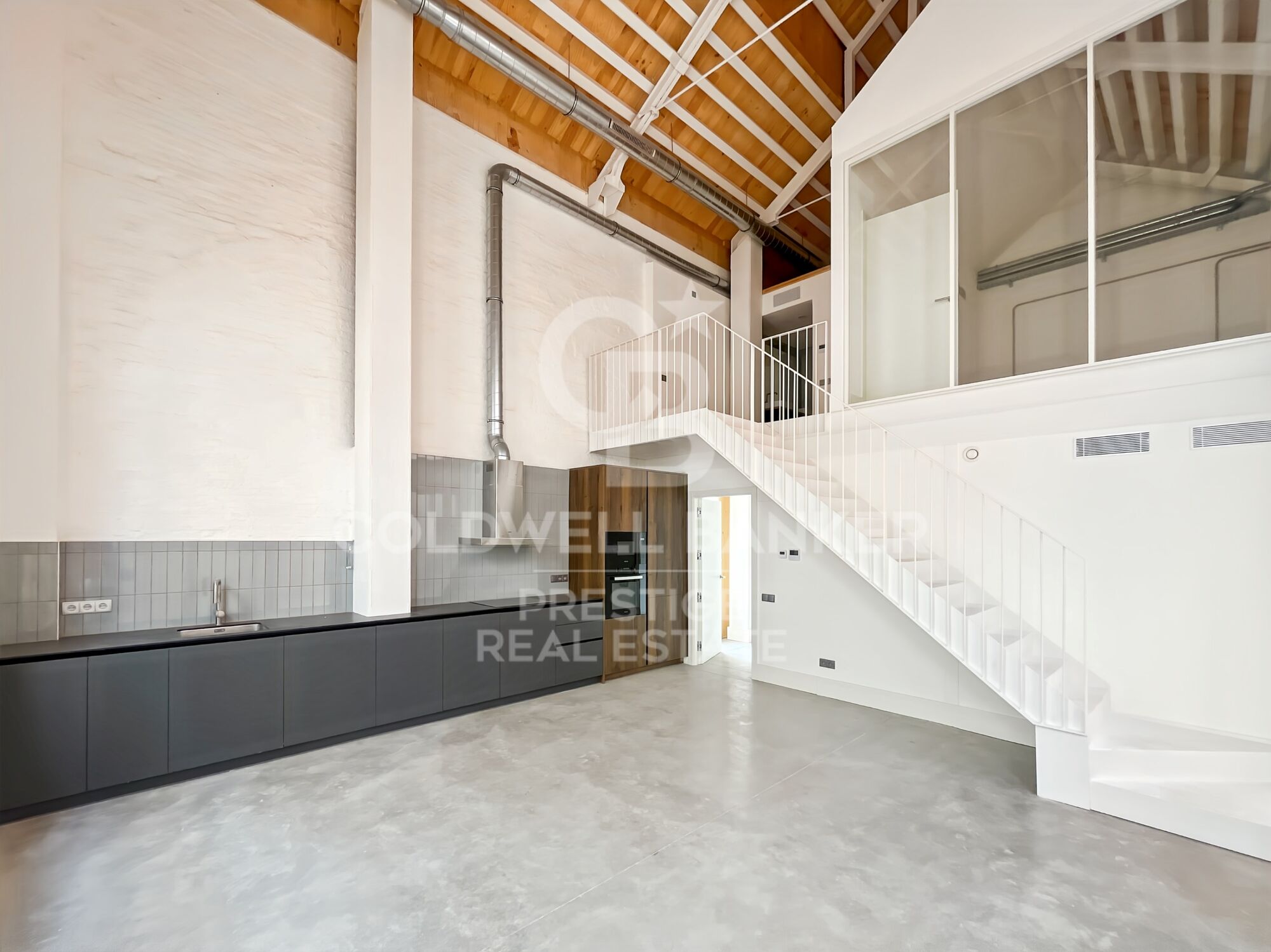 New development of 4 refurbished emblematic buildings with unique lofts for sale in Poblenou, Barcelona.