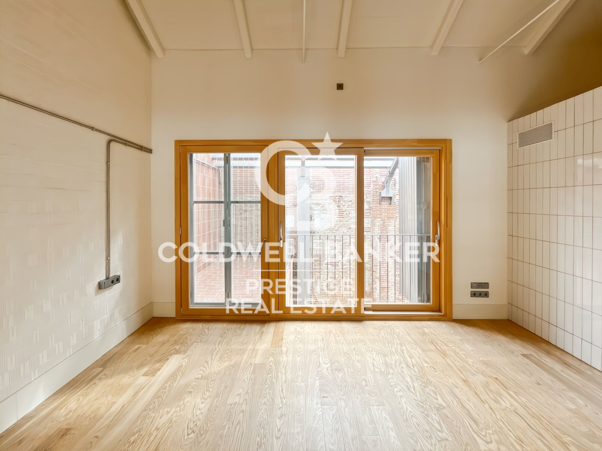 New development of 4 refurbished emblematic buildings with unique lofts for sale in Poblenou, Barcelona.