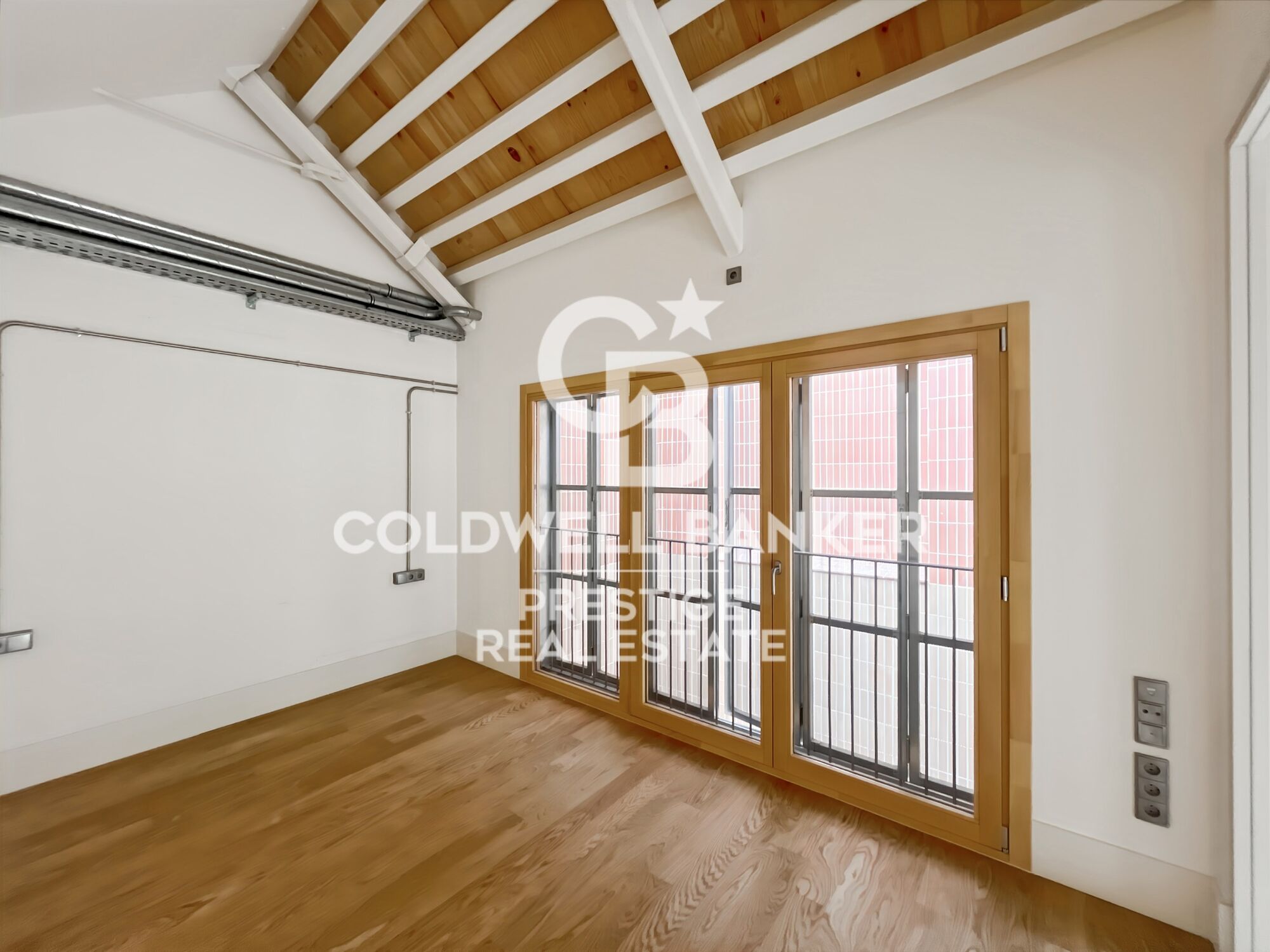 New development of 4 refurbished emblematic buildings with unique lofts for sale in Poblenou, Barcelona.