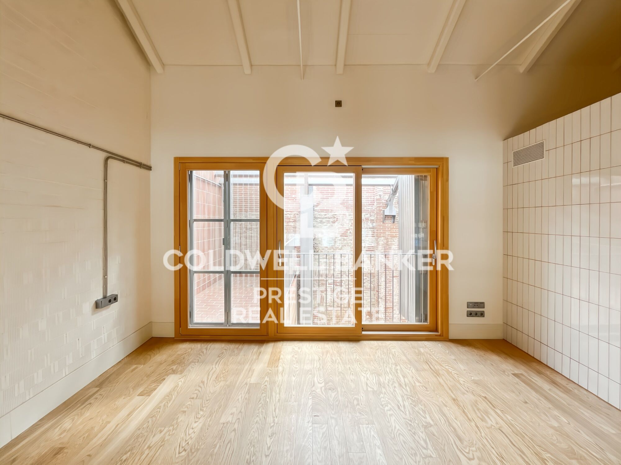 New development of 4 refurbished emblematic buildings with unique lofts for sale in Poblenou, Barcelona.