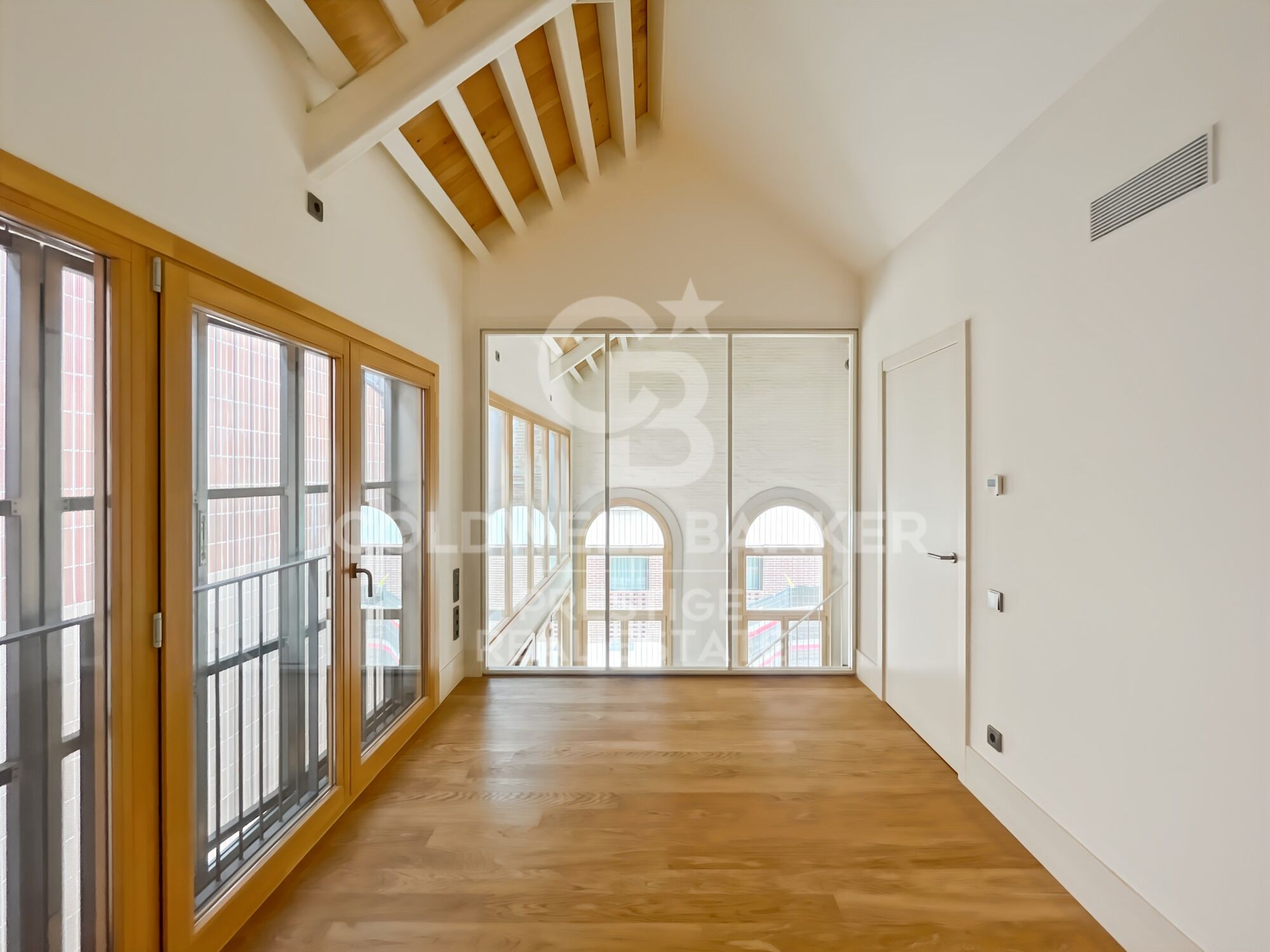 New development of 4 refurbished emblematic buildings with unique lofts for sale in Poblenou, Barcelona.