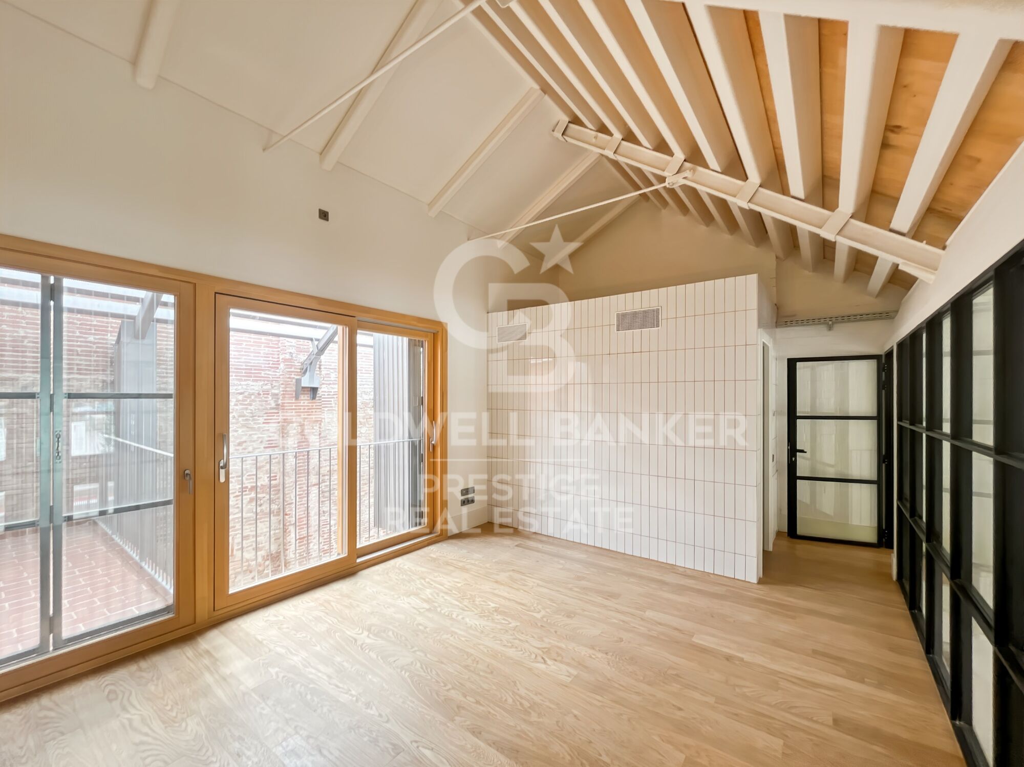 New development of 4 refurbished emblematic buildings with unique lofts for sale in Poblenou, Barcelona.
