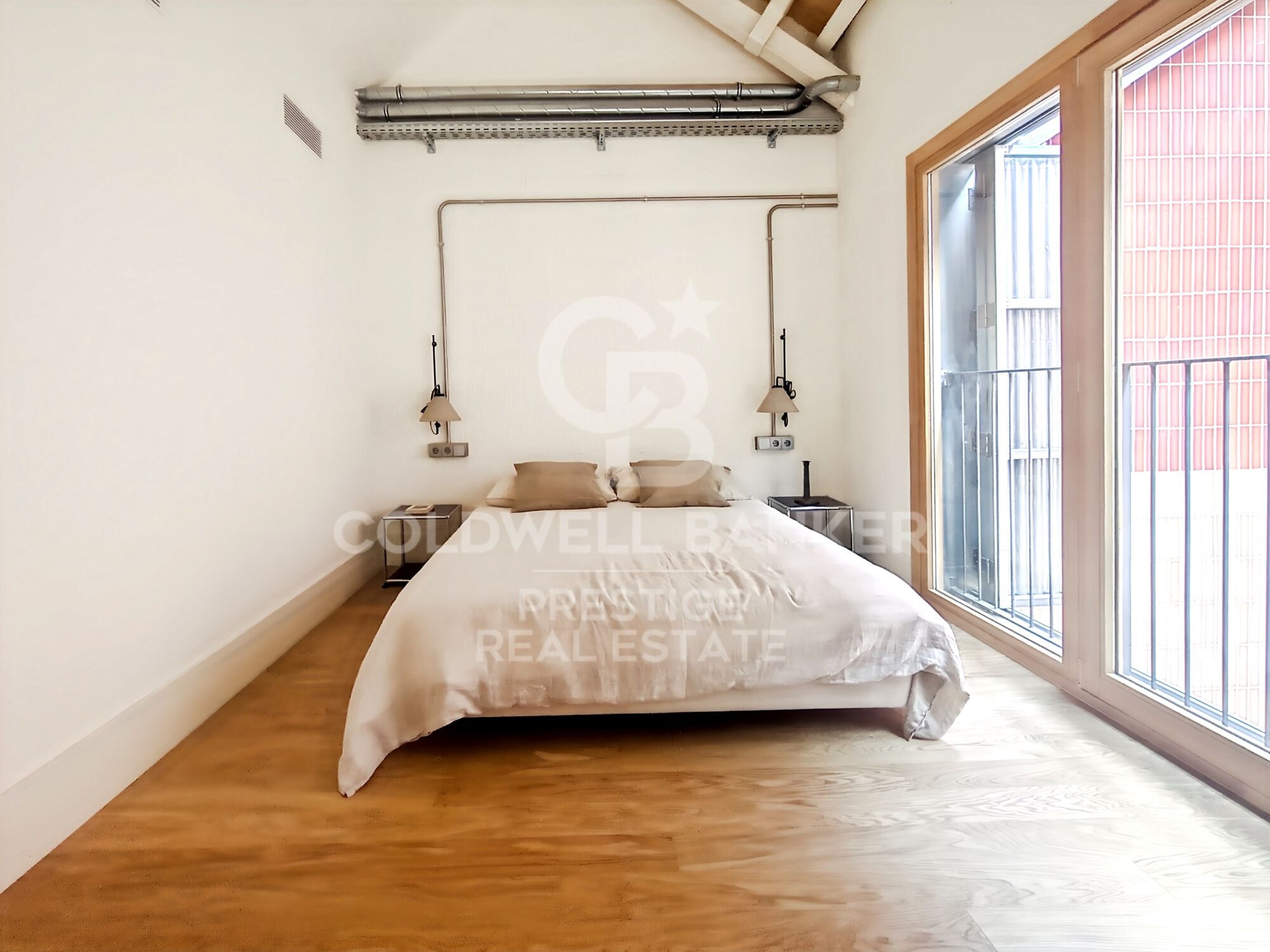 New development of 4 refurbished emblematic buildings with unique lofts for sale in Poblenou, Barcelona.